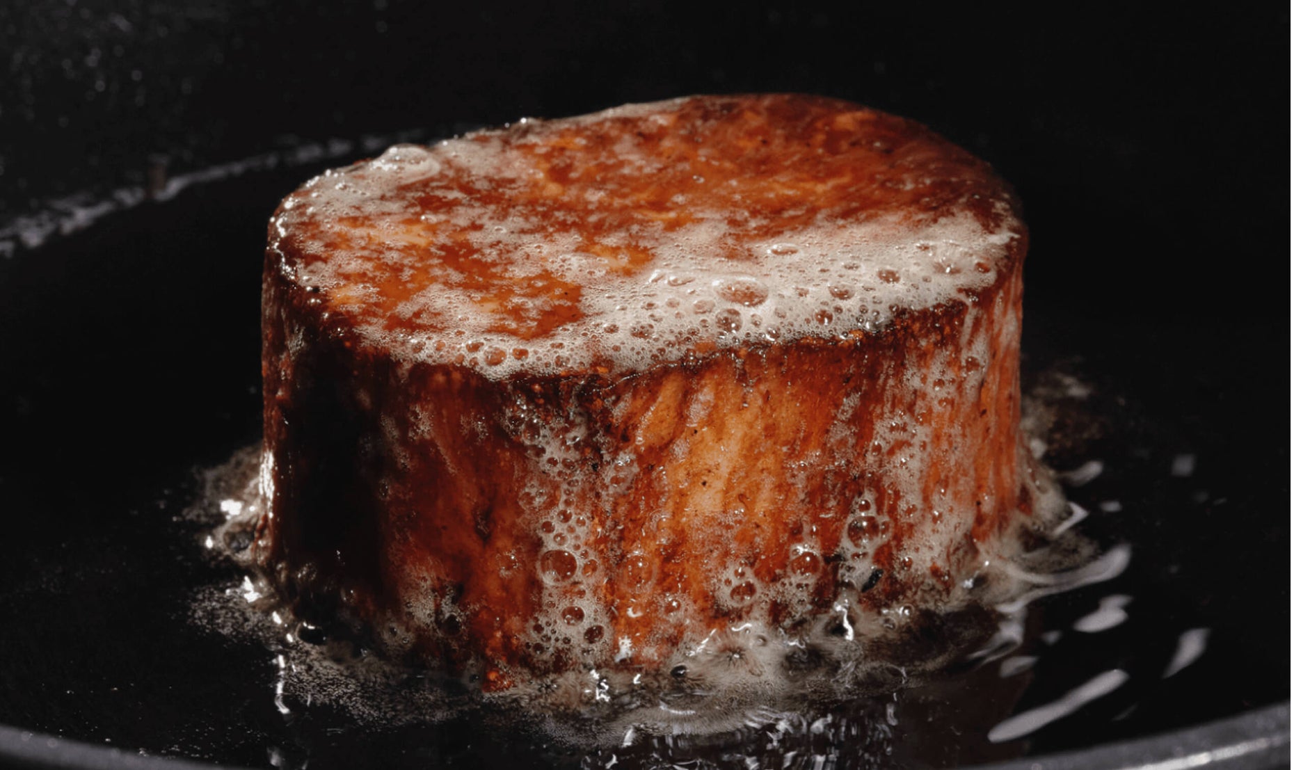 A whole-cut filet frying in butter